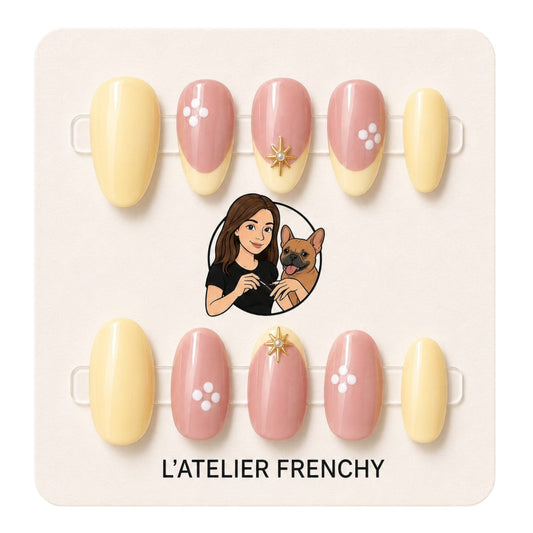 L'ATELIER FRENCHY Sunshine Blossom short almond press-on nails in pastel yellow and pink with floral and gold accents.